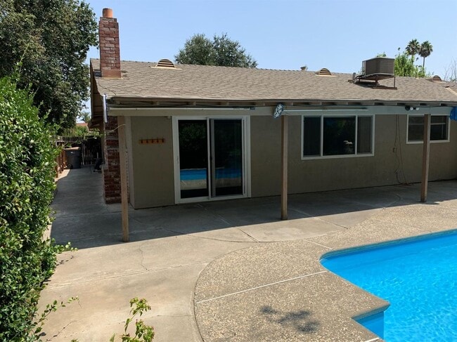 Building Photo - Enjoy the Backyard Pool at This 4-Bedroom ...