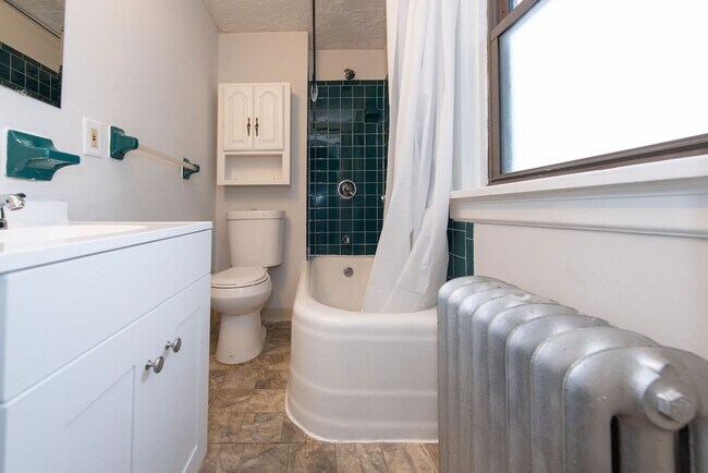 Building Photo - Beautifully updated Tudor style duplex. Up...