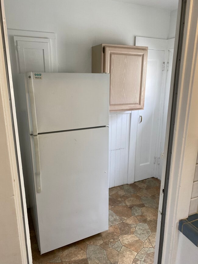 Pantry area adjacent to kitchen with stairs to basement - 165 Colon Ave