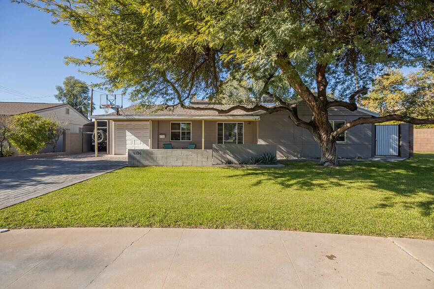 Front of home with mature ficus tree, shade and inviting curb appeal - 6136 N 9th St