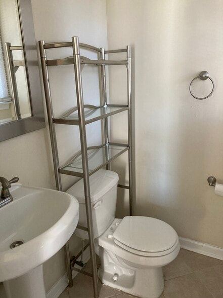 Half bath in primary bedroom - 7288 Beechtree Ln