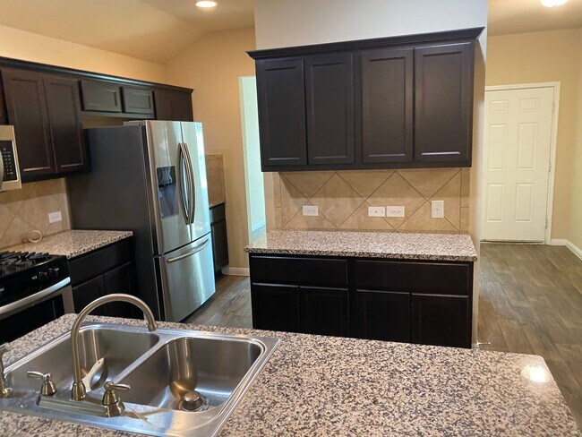 Building Photo - Three Bedroom, Two Bath, Two Car Garage, Washer and Dryer are included.