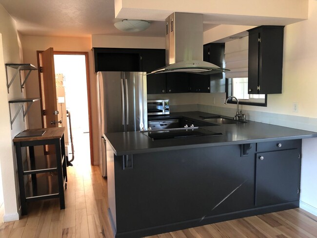 Building Photo - Live in Comfort and Style in the Heart of ...
