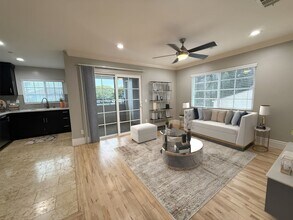 Building Photo - MOVE IN READY 2/2 with 2 Assigned Parking! In Unit Washer & Dryer! Gated Community! Centrally Loc...