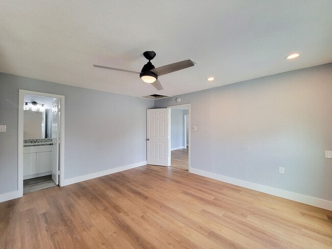 Building Photo - This beautifully updated 4-bedroom home is just under two miles from Highway 288 and Loop 610, ma...
