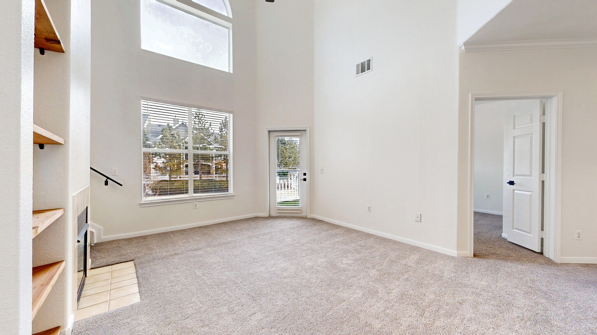Living Room with Vaulted Ceiling - 6021 Castlegate Dr W