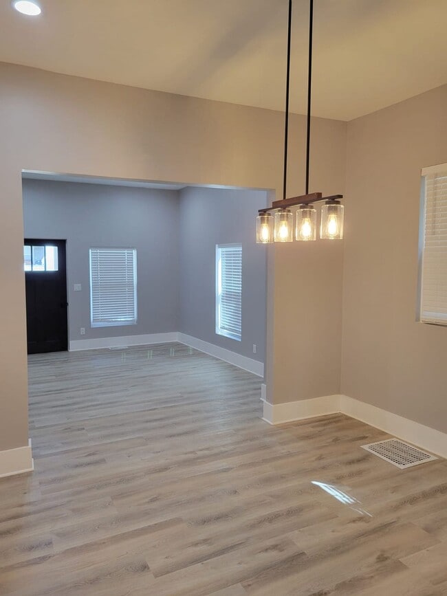 Building Photo - MOVE IN SPECIAL - Modern, Chic and brand new 2 bedroom with an office -   Discover This Home That...