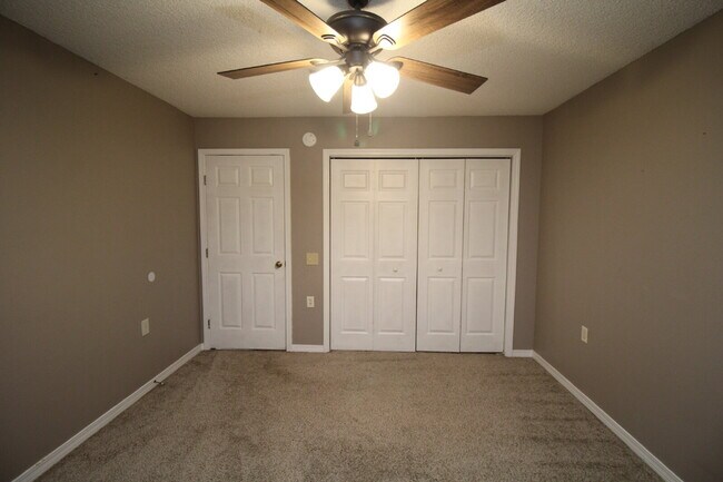 Building Photo - 2BR Patio Home with LVP Flooring, Private Fenced Yard, & Convenient Blue Angel Pkwy Location Near...
