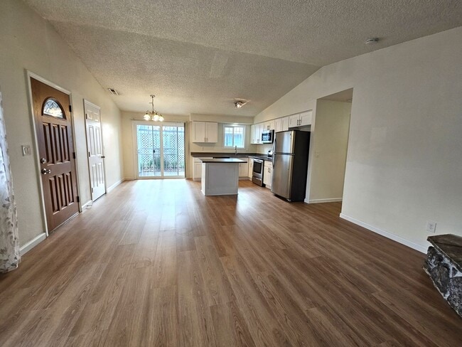 Building Photo - Charming Single-Level Home Featuring New Hardwood Floors, Bright Bedrooms & Open-Concept Living