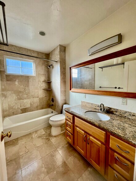 Travertine bathroom - 127 22nd Ave