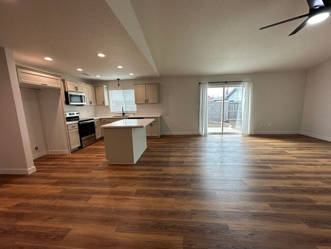 Building Photo - Updated Home with Island Kitchen, LVP Flooring, and Yard Care Included!