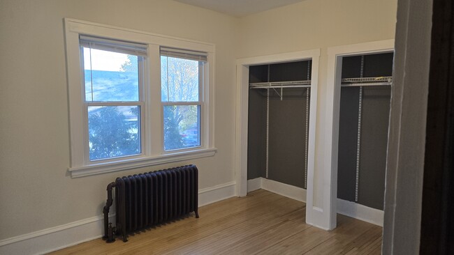 View from hallway, looking into bedroom #1, after getting a fresh paint color. - 533 Smith Ave S