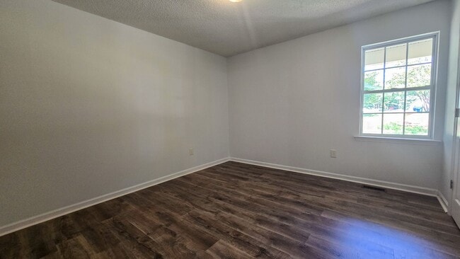 Building Photo - 5607 Whispering Pines Dr
