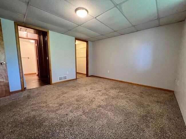 Building Photo - Spacious 3BR Duplex with Finished Basement & 2-Car Garage in Otsego