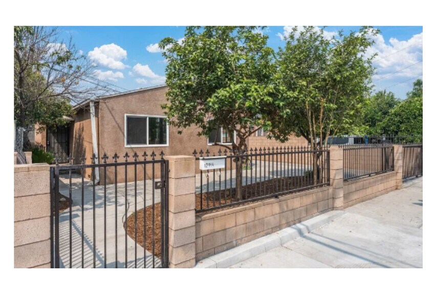 Main entrance view from the sidewalk - 12944 Bess Ave