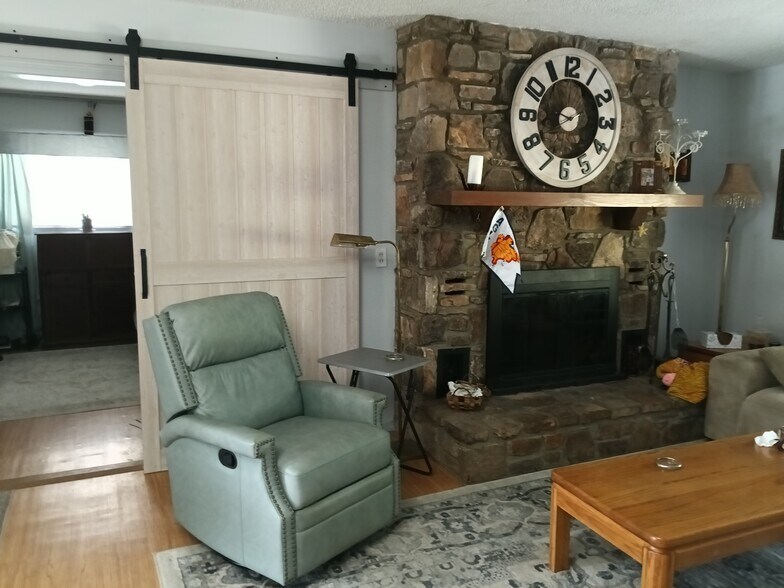 Living room with wood fireplace - 83 Monongahela Dr