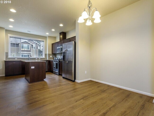 Building Photo - Neat and Tidy Newer Town Home with Two Master Bedrooms and Den on the Main Level