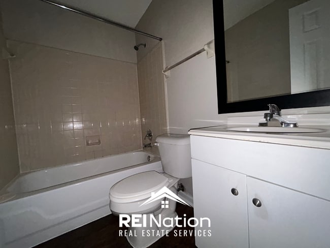 Building Photo - Spacious 4BR/2BA Near Southwind | High Ceilings, Brick Fireplace & 2-Car Garage