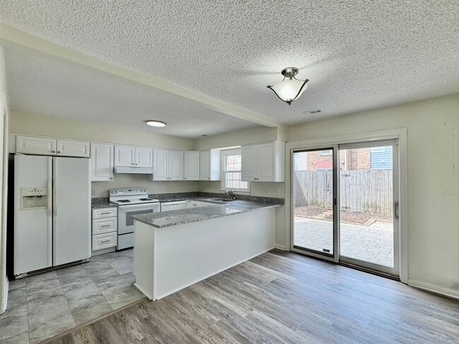 Building Photo - READY NOW!! Fenced Patio - Pet Friendly - Over 1,500 Square Feet!!