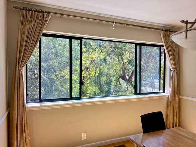 Building Photo - Great Natural light, Treetop Views with 2 Primary Suites plus OFFICE and a 2 car garage, It is li...