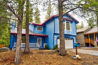 Building Photo - Large mountain home with 2 car garage and fenced in back yard.