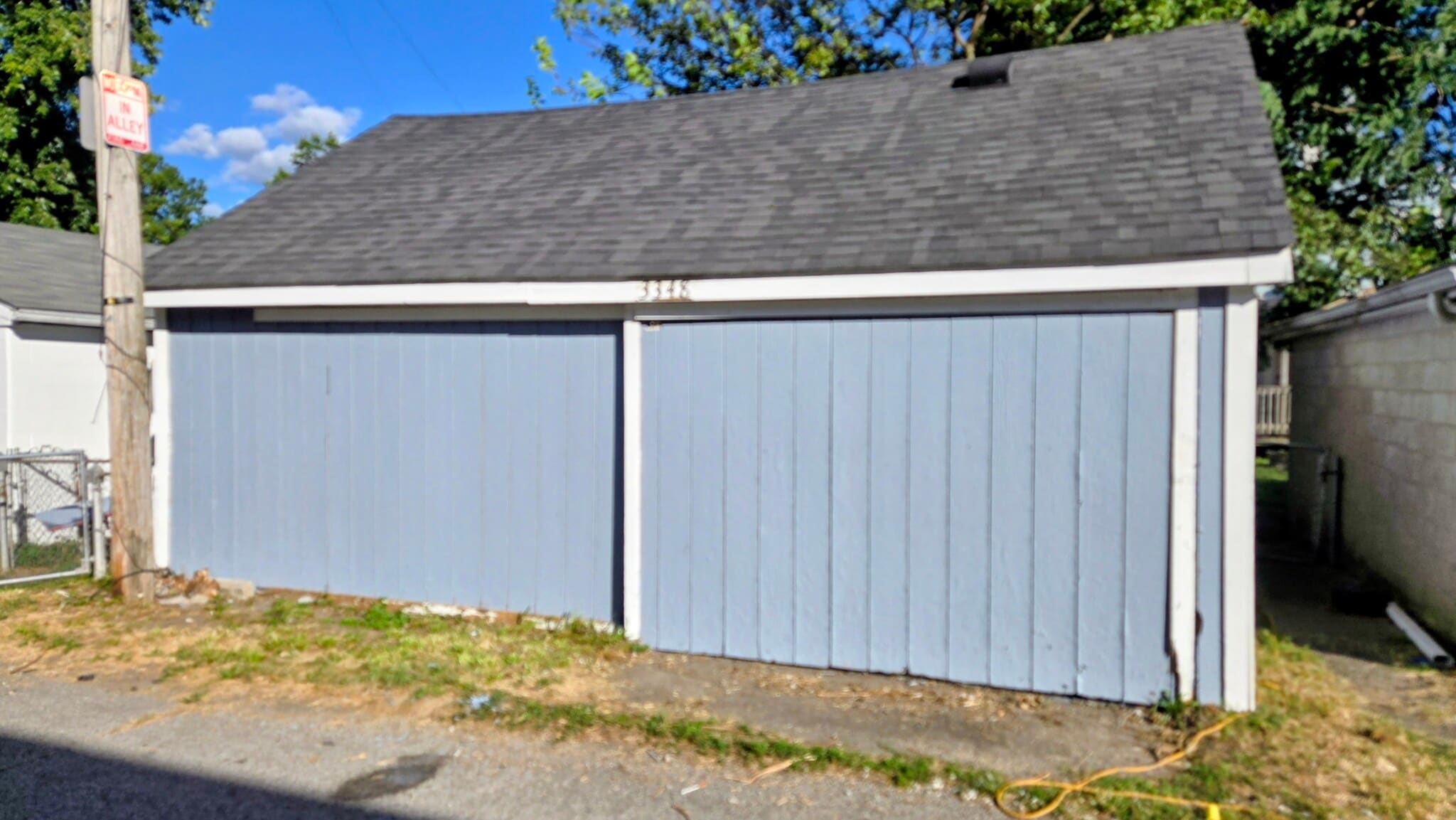 The garage has sliding doors with alley access - 3348 Bohannon Ave