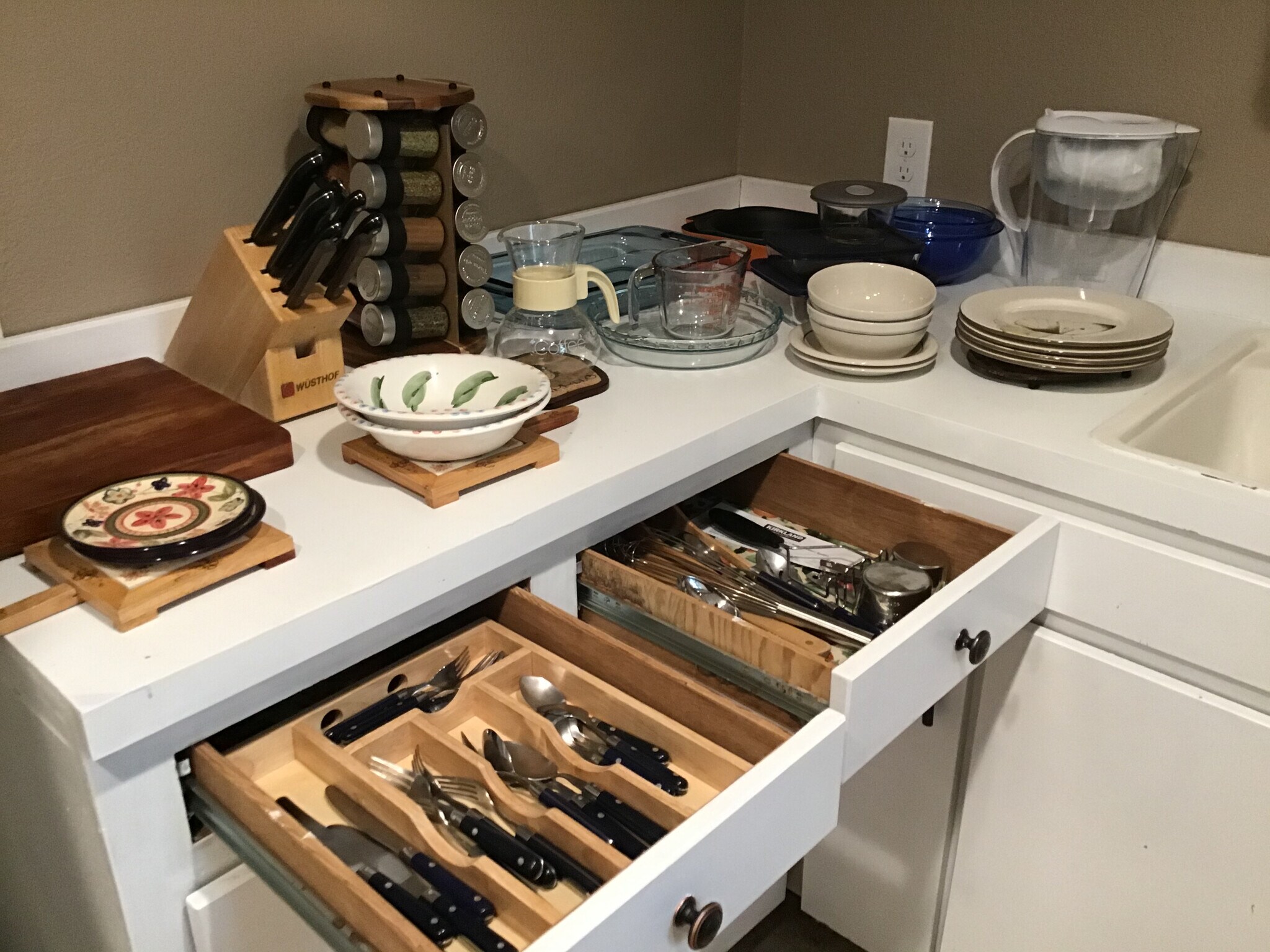 Fully stocked with plates and utensils. - 17405 Ashworth Ave N