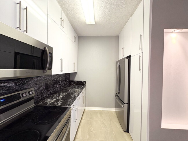 Building Photo - Available Now! Spacious 2-Bed, 2-Bath Cond...