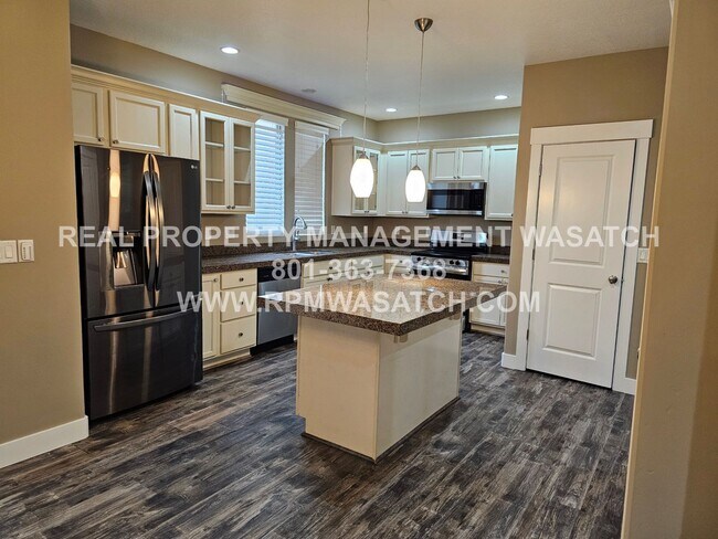 Building Photo - 4 Bedroom 2.5 Bath Town Home in Daybreak! MOVE IN SPECIAL 1/2 Off 1st Months Rent