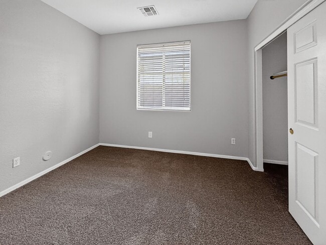 Building Photo - Single-level 4 bed, 2 bath home with tandem 3-car garage and RV gate.