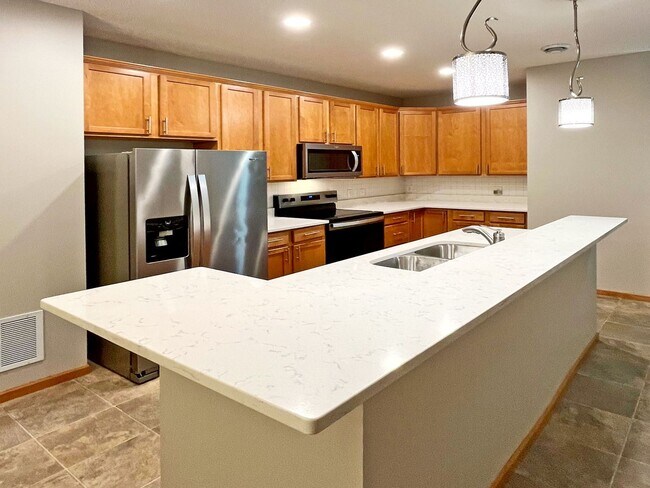 Building Photo - Upscale Townhome with Large Office-Loft, 3 Baths, 2-Car Attached Garage, Quartz Countertops and M...