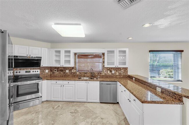 Building Photo - 5911 NW 59th Ave