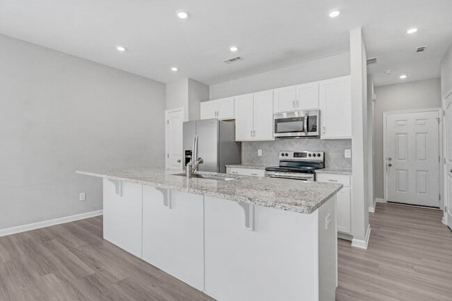 Building Photo - DRAKE ESTATES 3 BR | 2 BA Townhome w/ 2-Car Garage! *Built in 2023*