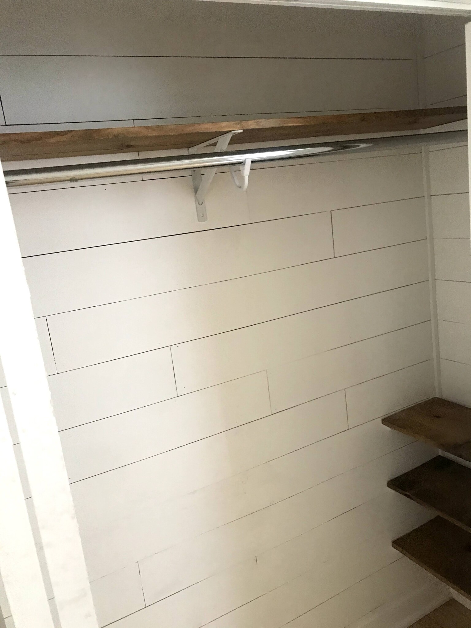 Shiplap closet in larger bedroom. - 1233 Jenifer St