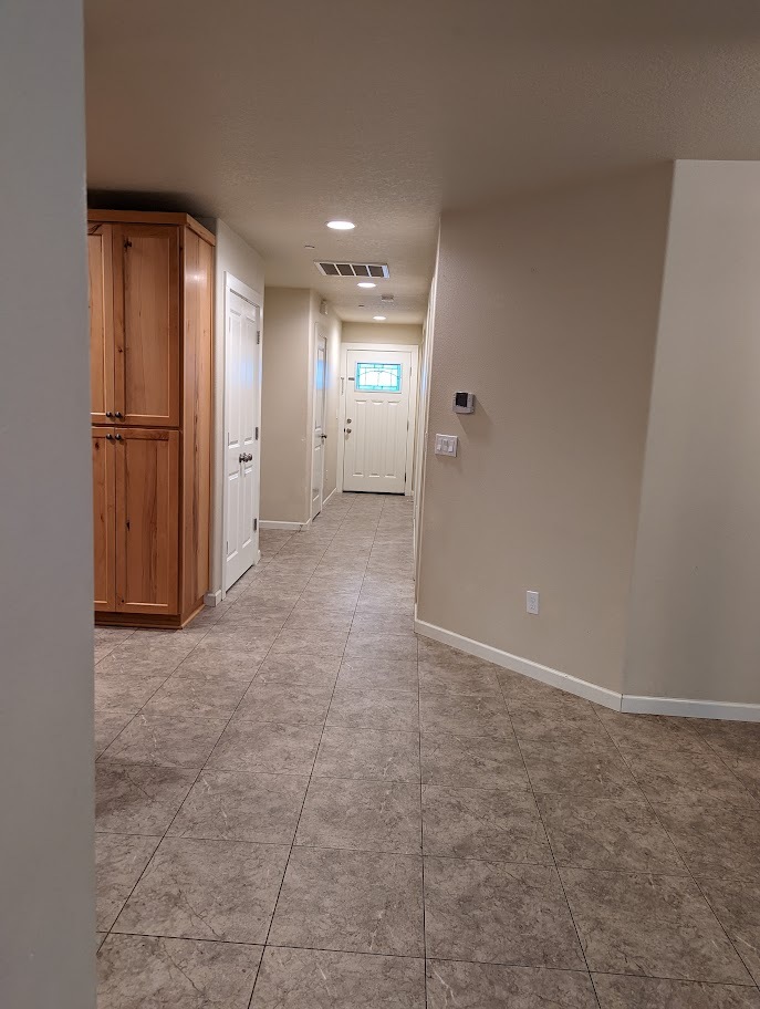 Hallway from slider facing front door (kitchen on left) - 713 E Main St