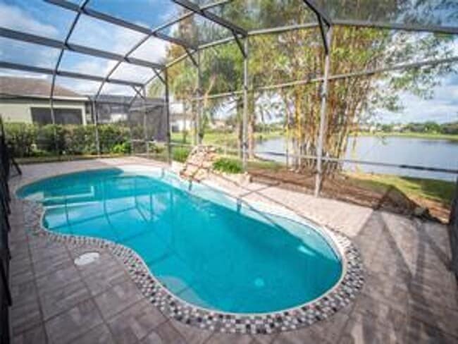Building Photo - Spacious 4/3.5 Pool Home with Water View & 3-Car Garage in Lee Vista Area (close to Lake Nona)
