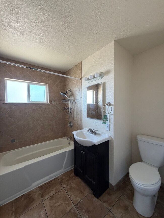 Building Photo - 3 Bedroom 2 Bathroom House with Central A/C , 2 Car Garage and Beautiful Backyard with Covered Patio