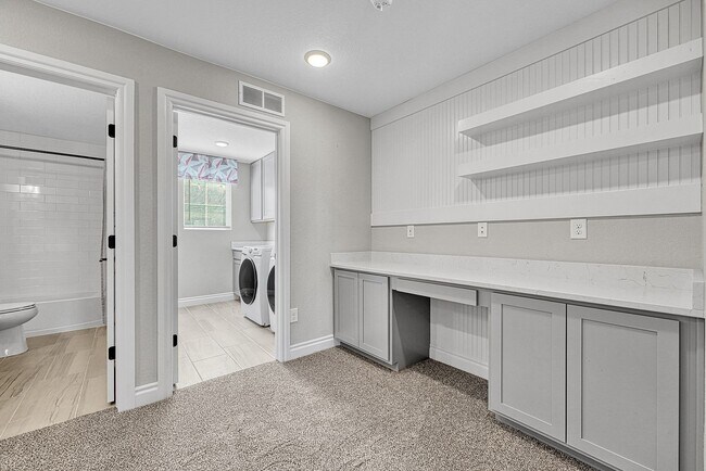 Building Photo - Former Model Home - Superb townhome in great location!