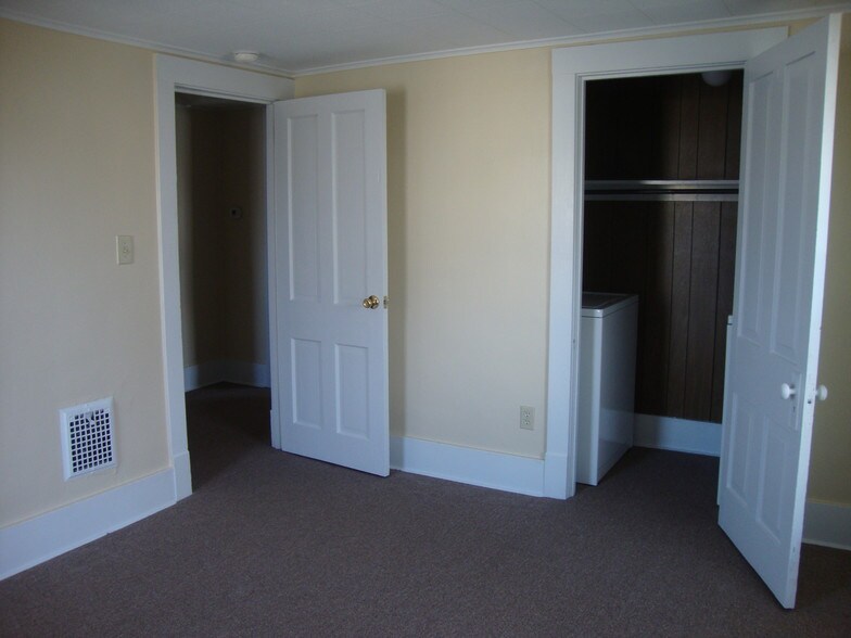 Front bedroom with laundry closet. - 225 College Ave