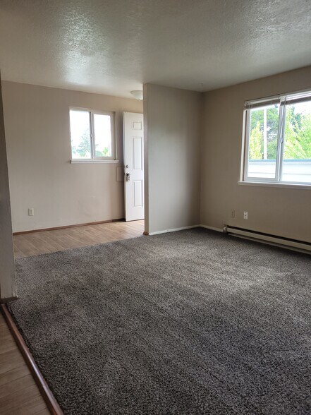 unit d living room with big window to deck - 1045 S Jasper St