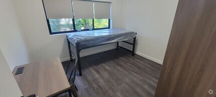 Building Photo - Beds Available Newly Renovated Building , ...