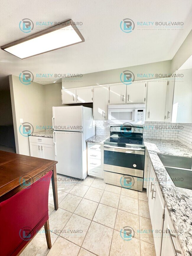 Building Photo - 2-bed, 2-bath, 2-story townhome with pool and park like setting outside the front door.