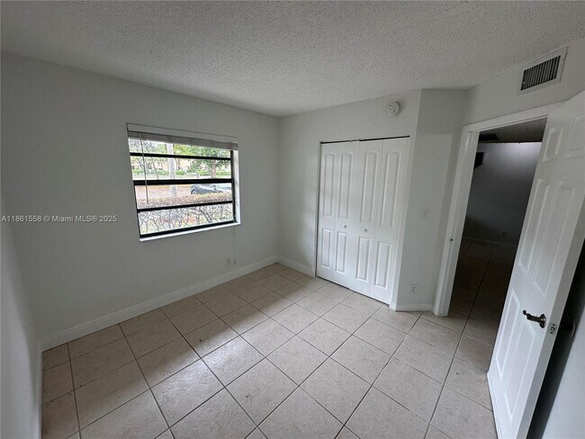 Building Photo - 11213 Royal Palm Blvd