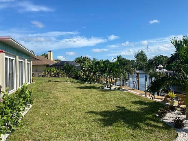Building Photo - Palm City Home with Dock and Lift
