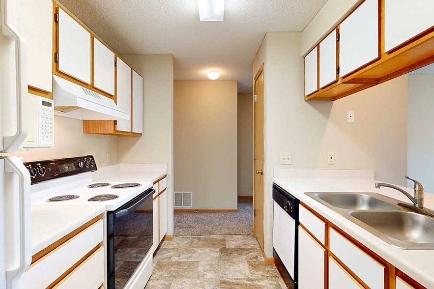 Efficient galley kitchens keep everything within easy reach to make meal prep and cleanup flow smoothly. - Skyline View