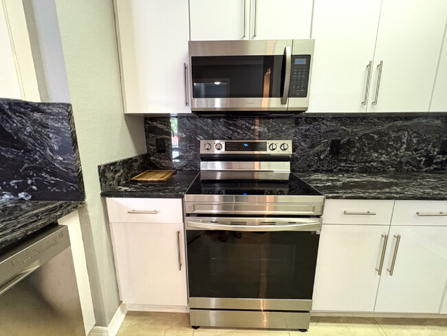 Building Photo - Available Now! Spacious 2-Bed, 2-Bath Cond...