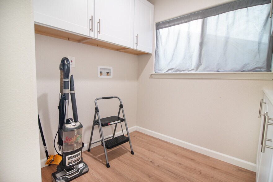 Washer and dryer are now in laundry room/ We do still provide vacuum and step stool during your stay - 604 S 8th St