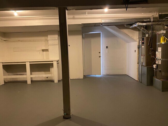 Building Photo - Stylishly Renovated Home with Private Back...