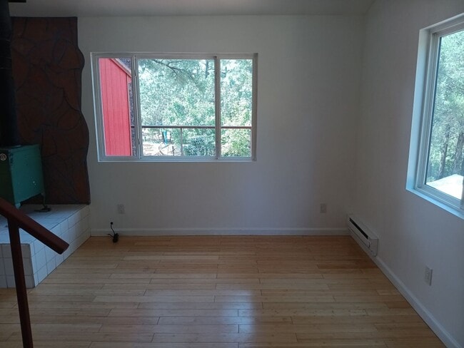 Building Photo - COZY HOME IN THE BEAUTIFUL TOWN OF TIJERAS | Showings available NOW!!