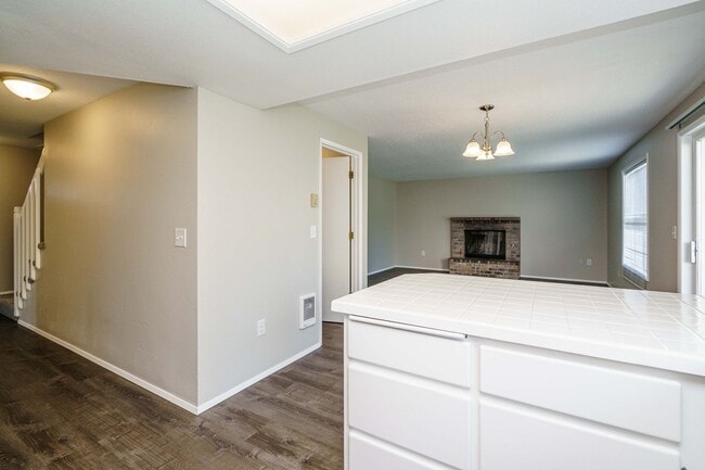 Building Photo - Recently Updated with Wood Laminate Flooring and Fresh Paint